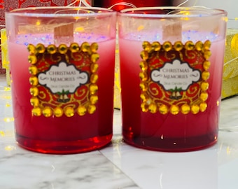 6 oz red Christmas Memories Candle with crackling wood wick. Plastic lid.