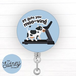 May include: A light blue badge reel with a cartoon cow on a treadmill. The text "PT gets you moo-ving" is above the cow. The badge reel has a clear plastic strap and a metal clip.