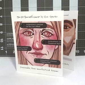 May include: A watercolor illustration titled "Do-It-Yourself-Care" by Rue Sparks. The artwork features a close-up of a face with text bubbles that read "Achievement unlocked: Car You Can't Afford", "Career You Hate", "Overpriced Apartment", and "Crippling Debt". The phrase "Disassemble those manufactured dreams" is written at the bottom.