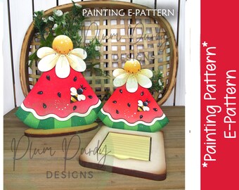 May include: Painting pattern for a watermelon slice with a bee and a daisy on top. The pattern is for a wooden cutout that can be used as a note holder. The pattern is available as a digital download.