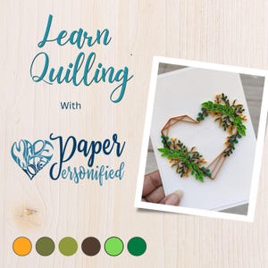 May include: A white card featuring a geometric heart design crafted from brown paper and adorned with green and yellow paper quilling. The card is held by a hand. The text "Learn Quilling with Paper Personified" is written in teal.