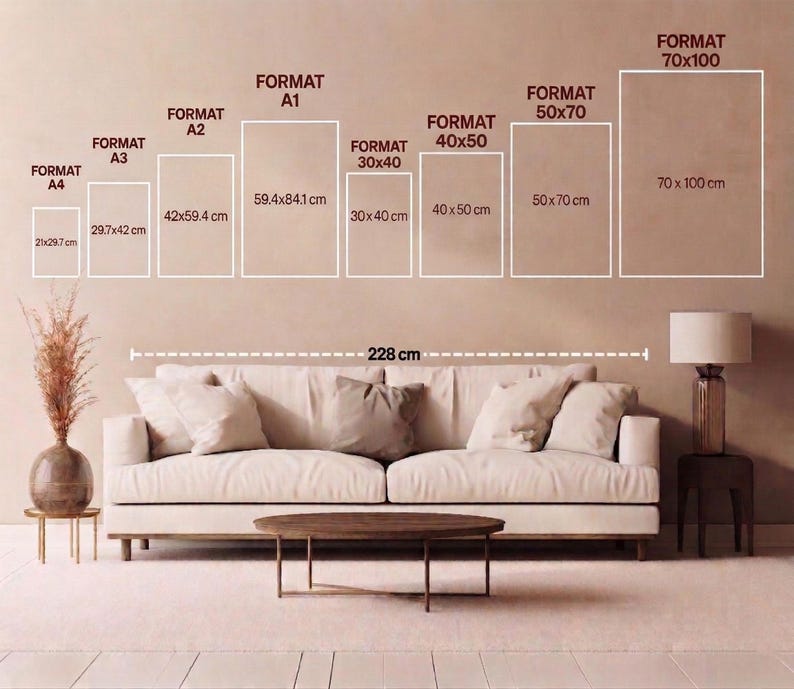 a living room with a large couch, a coffee table, and a lamp. The couch is positioned in front of a wall with a series of format sizes and dimensions written on it, indicating different sizes of the couch.