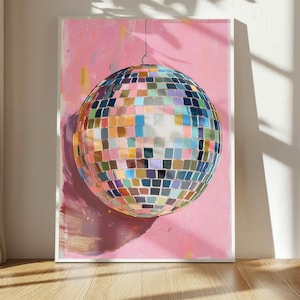 a vibrant, colorful disco ball with a pink background.