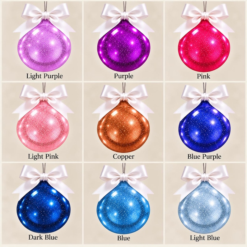 May include: A grid of nine spherical ornaments, each featuring a glossy, glitter-infused finish in various colors including light purple, purple, pink, light pink, copper, blue-purple, dark blue, blue, and light blue, topped with a white satin bow.