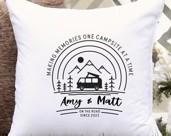 May include: White square pillow with a black graphic of a camper van, mountains, trees, and the text "MAKING MEMORIES ONE CAMPSITE AT A TIME." Below the graphic are the names "Amy & Matt" and the text "ON THE ROAD SINCE 2022."