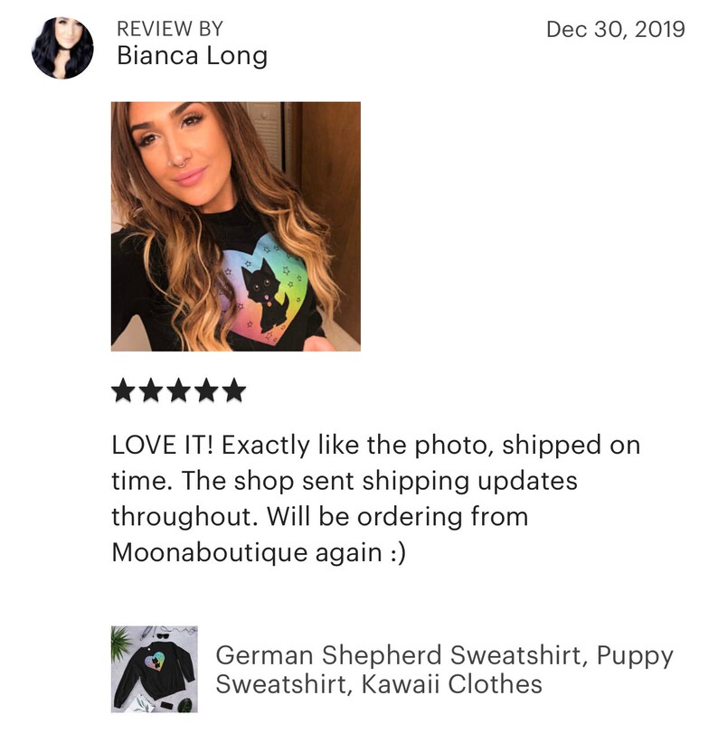 May include: Black sweatshirt with a rainbow heart and a black silhouette of a German Shepherd puppy inside the heart. The text "LOVE IT! Exactly like the photo, shipped on time. The shop sent shipping updates throughout. Will be ordering from Moonaboutique again :)" is below the image.