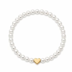 May include: A bracelet of white pearls with a gold heart charm. The pearls are small and round, strung together to form a circular bracelet. A gold heart charm is positioned centrally.