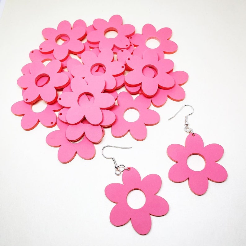 cute laser cut pastel pink acrylic flower earrings. YOU GROW GIRL