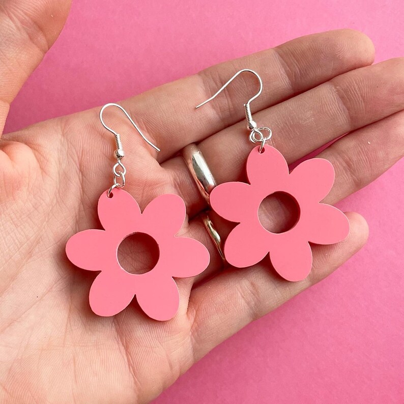 cute laser cut pastel pink acrylic flower earrings. YOU GROW GIRL