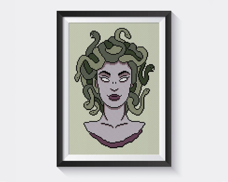 May include: A cross-stitch pattern of Medusa, a mythical Greek figure with snakes for hair. Her face is pale with dark eyes and a subtle smile. The snakes are green and brown.