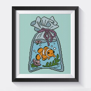 May include: A cross-stitch pattern of a cartoon clownfish swimming in a plastic bag tied with a purple ribbon. The bag is filled with blue water and has bubbles and seaweed inside.