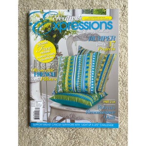 May include: A magazine cover for Creative Expressions with Jenny Maskins. The cover features a colorful striped and floral pillow on a white chair. The magazine title is in bold, black letters. The cover text includes "BUMPER Issue 17 Projects" and "Part 2 of Robyn's Renaissance Quilt".