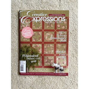 May include: A magazine cover for Creative Expressions, a machine embroidery and quilting magazine. The cover features a whimsical bunny cot quilt, a Renaissance quilt, and a free embroidery design to download. The magazine is published by Jenny Halstead.