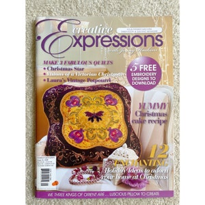 May include: A magazine cover featuring a purple and gold pillow with a butterfly design. The magazine is titled "Creative Expressions" and features the text "Make 3 Fabulous Quilts" and "5 Free Embroidery Designs to Download".