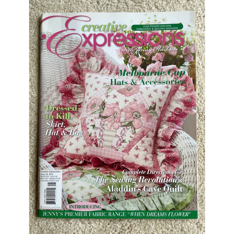May include: A magazine cover featuring a pink and white floral pillow with ruffles. The magazine is titled "Creative Expressions" and features the text "Melbourne Cup Hats & Accessories" and "Dressed to Kill Skirt, Hat & Bag".