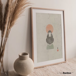 May include: A framed print with a minimalist illustration of a monkey sitting on a green circle with a red circle behind it. The background is a light beige with a textured look. The Japanese character "友" is printed in red in the bottom right corner.