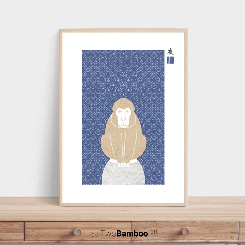May include: A framed print of a brown monkey sitting on a white circle against a blue background with a white pattern. The Japanese character for "friend" is in the top right corner of the print.