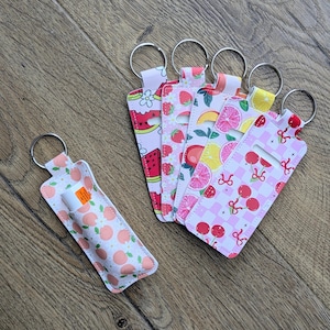 Fruchtiger Kunstleder Lippenbalsamhalter | Schlüsselanhänger für Taschen & Gürtel | Niedliches Brillenetui. Zurück zu Schulzubehör