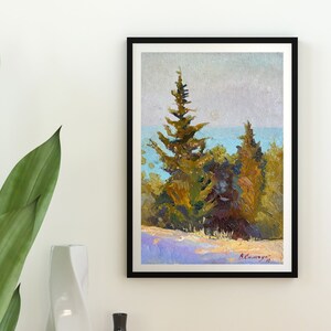 May include: A framed oil painting depicting a landscape scene with three pine trees in the foreground. The trees are painted in shades of green, brown, and yellow. The background features a blue body of water and a hazy sky. The painting is signed "B.Cawvey" in the lower right corner.