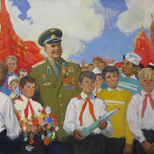 May include: A painting of a military officer in uniform standing with a group of children. The officer is wearing a green uniform with medals and a cap. The children are holding flowers and a model rocket. The painting is set against a backdrop of red flags and a blue sky.