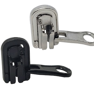 May include: Two zipper pulls, one silver and one black. Both have a slider and a loop. The silver zipper pull has a metal loop, while the black zipper pull has a plastic loop.