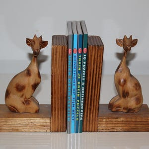 Vintage bookends , giraffe | Wooden bookend , Africa statues | Bookcase decor , library and book .