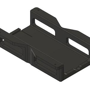 May include: A black, rectangular, 3D-printed object with a hollowed-out center and two handles. The object has a box-like shape with a flat base and is designed with a series of cutouts and holes.