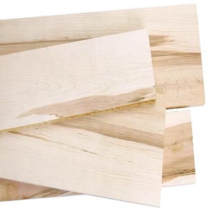 May include: A stack of unfinished, light-colored wooden boards. The boards have a natural wood grain pattern with variations in color, ranging from pale yellow to light brown. The edges of the boards are cleanly cut, and the wood appears smooth and ready for use.