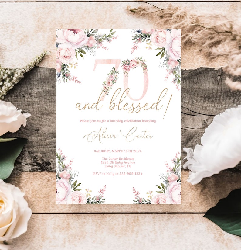 May include: A white invitation card with floral accents and the text "70 and blessed!". The number 70 is decorated with pink flowers. The invitation includes details for a birthday celebration, including the date, location, and RSVP information.