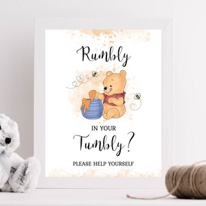 May include: A Winnie the Pooh themed sign with a watercolor background. The sign says "Rumbly in your Tumbly? Please help yourself". Winnie the Pooh is pictured pouring honey from a pot into a blue bowl.