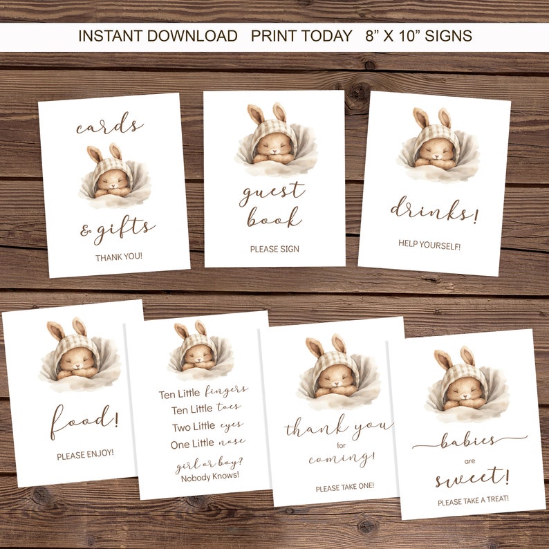 Pu&ograve; includere: Segnali stampabili da 20,3 x 25,4 cm per un baby shower. I segnali presentano un simpatico coniglietto dei cartoni animati con il testo "biglietti e regali", "libro degli ospiti", "bevande", "cibo", "grazie per essere venuto", e "i bambini sono dolci".