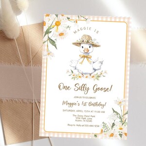 May include: A pink and white gingham background with a white border. A cartoon goose wearing a straw hat and a yellow bow is in the center of the card. The text "Maggie is One Silly Goose!" is in brown text. The text "Join us to celebrate Maggie's 1st Birthday!" is in brown text. The text "Saturday, April 15th at 11:00 AM" is in brown text. The text "The Daisy Pond Park 1234 Park Lane Austin, TX 12345" is in brown text. The text "Rsvp to Holly at 555-444-1234" is in brown text.