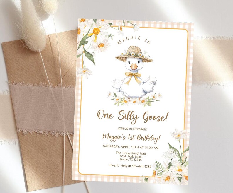 May include: A pink and white gingham background with a white border. A cartoon goose wearing a straw hat and a yellow bow is in the center of the card. The text "Maggie is One Silly Goose!" is in brown text. The text "Join us to celebrate Maggie's 1st Birthday!" is in brown text. The text "Saturday, April 15th at 11:00 AM" is in brown text. The text "The Daisy Pond Park 1234 Park Lane Austin, TX 12345" is in brown text. The text "Rsvp to Holly at 555-444-1234" is in brown text.