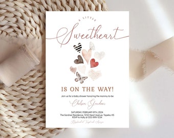 May include: A white baby shower invitation with a watercolor illustration of pink, red, and brown hearts and butterflies. The text reads "A Little Sweetheart Is On The Way!" and includes the date, time, and location of the event.