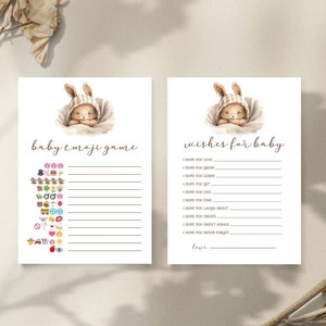 Może przedstawiać: Dwie drukowane karty do gry na baby shower z uroczą ilustracją kr&oacute;liczka. Pierwsza karta to gra w emoji dla dziecka z listą emoji. Druga karta to karta z życzeniami dla dziecka z listą życzeń dla dziecka.