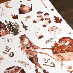 May include: A set of watercolor stickers featuring a girl pushing a wheelbarrow full of pumpkins, a cabin, a teapot, a mug, socks, a tea bag, leaves, and other autumnal elements. The stickers are in shades of brown and beige.