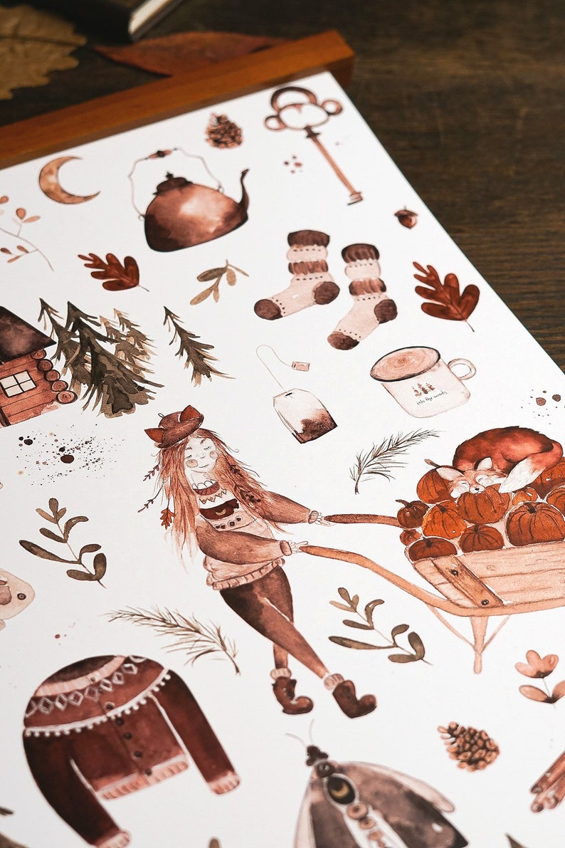 May include: A set of watercolor stickers featuring a girl pushing a wheelbarrow full of pumpkins, a cabin, a teapot, a mug, socks, a tea bag, leaves, and other autumnal elements. The stickers are in shades of brown and beige.