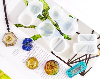 May include: A set of four clear silicone molds for making resin jewelry. The molds are shaped like a hexagon, a circle, and two rectangles. There are several finished resin pieces in the image, including a hexagon, a circle, and a rectangle.