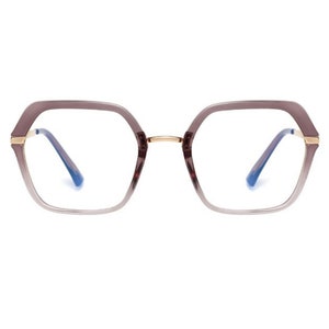 May include: A pair of eyeglasses with a gold frame and a gradient lens that transitions from a darker shade of purple to a lighter shade of purple.