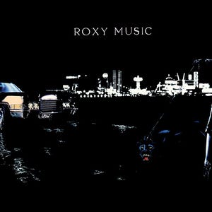 May include: A dark, stylized image featuring the text "ROXY MUSIC" at the top. The scene includes a classic car, a person, and a dog-like creature, all set against a cityscape backdrop. The overall aesthetic is dramatic and evocative.