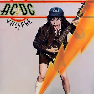 May include: Poster featuring a musician playing a guitar, with the band name "AC/DC" in green and red. The image includes the words "HIGH VOLTAGE" and "On Records and Tapes". The musician is wearing a blue cap with a white "A".