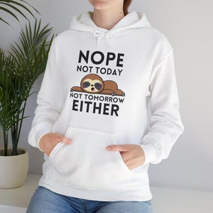 May include: White hoodie with a sloth graphic and the text "NOPE NOT TODAY NOT TOMORROW EITHER".