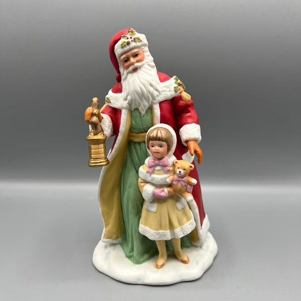 Figurine vintage du père Noël Avon 1995 avec une petite fille. Collection Avon Source of Fine.