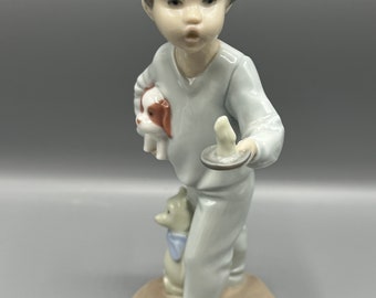 Figura de porcelana vintage NAO Lladró: Niño con vela, perro y