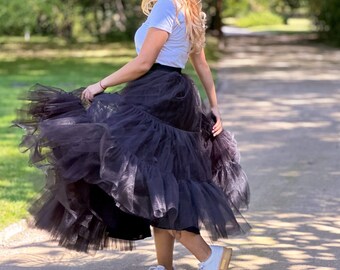 This black skirt is an absolute must-have for any fashion-forward Lady The black colors and comfortable fit make it ideal for any occasion.