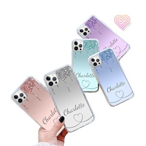 May include: Five clear phone cases with glitter accents and a dripping paint design. Each case has a different colour gradient and features the name "Charlotte" and a heart design.