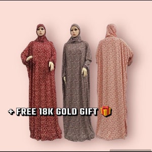 May include: Three long, loose-fitting robes with floral patterns in red, gray, and pink. The robes have a hood and long sleeves.  + FREE 18K GOLD GIFT