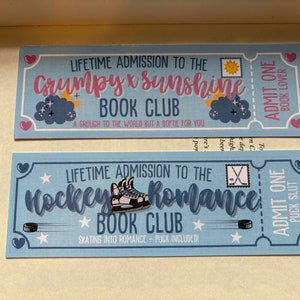 May include: Two light blue book club tickets. One says "Grumpy x Sunshine Book Club" with a cloud graphic. The other says "Hockey Romance Book Club" with a hockey skate graphic. Both tickets have text and heart and star accents.