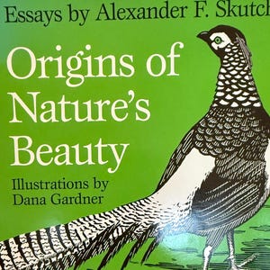 May include: A hardcover book titled "Origins of Nature's Beauty" by Alexander F. Skutch, with illustrations by Dana Gardner. The cover features a detailed illustration of a bird and colorful frogs on a green background.