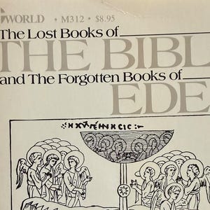 May include: A paperback book titled "The Lost Books of The Bible and The Forgotten Books of Eden." The cover features a black and white illustration of religious figures and scenes. The book has a white background with text at the top.